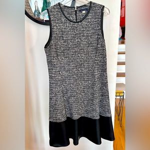 Office wear to evening dinner party dress. Has bottom leather hem. Aline fit